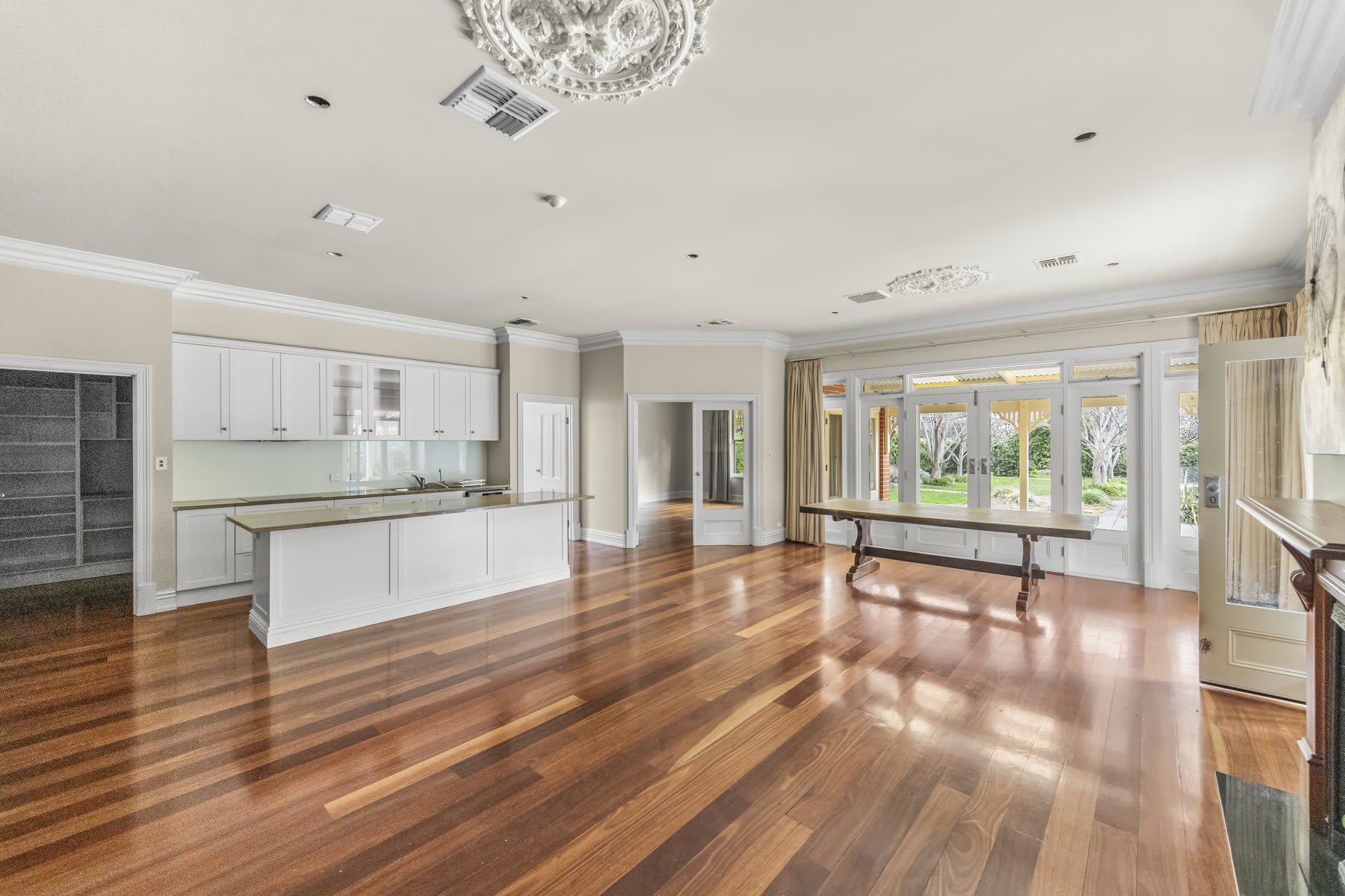 Renovated open-plan kitchen and living area with polished timber floors